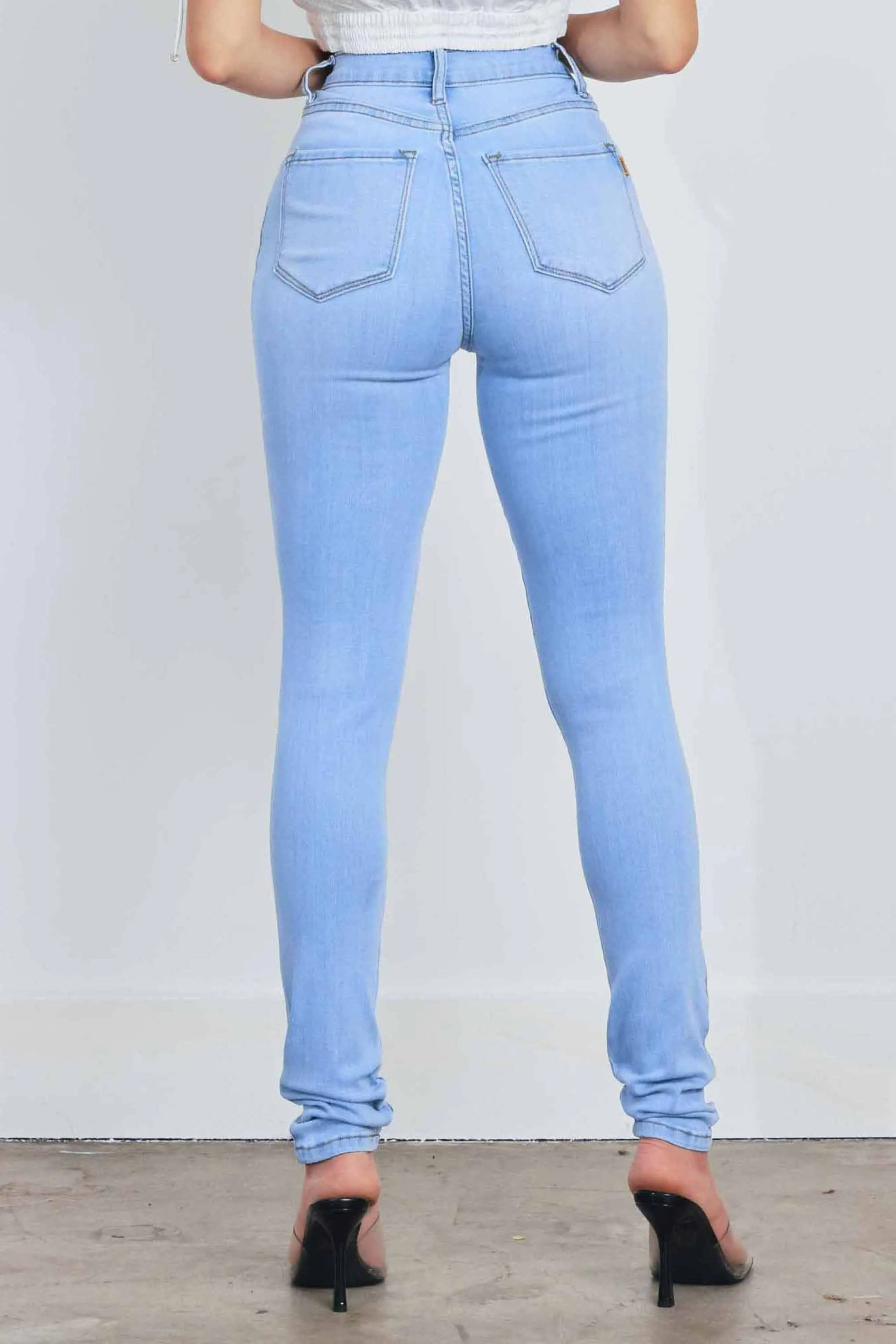 HIGH WAISTED SKINNY W DISTRESS DETAIL