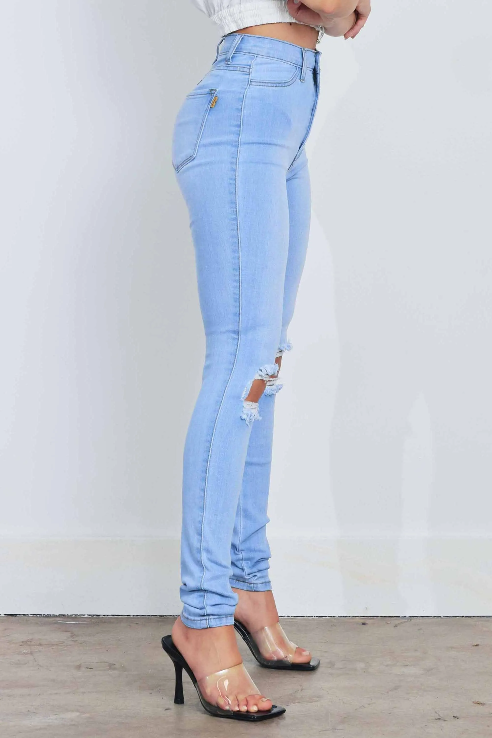 HIGH WAISTED SKINNY W DISTRESS DETAIL
