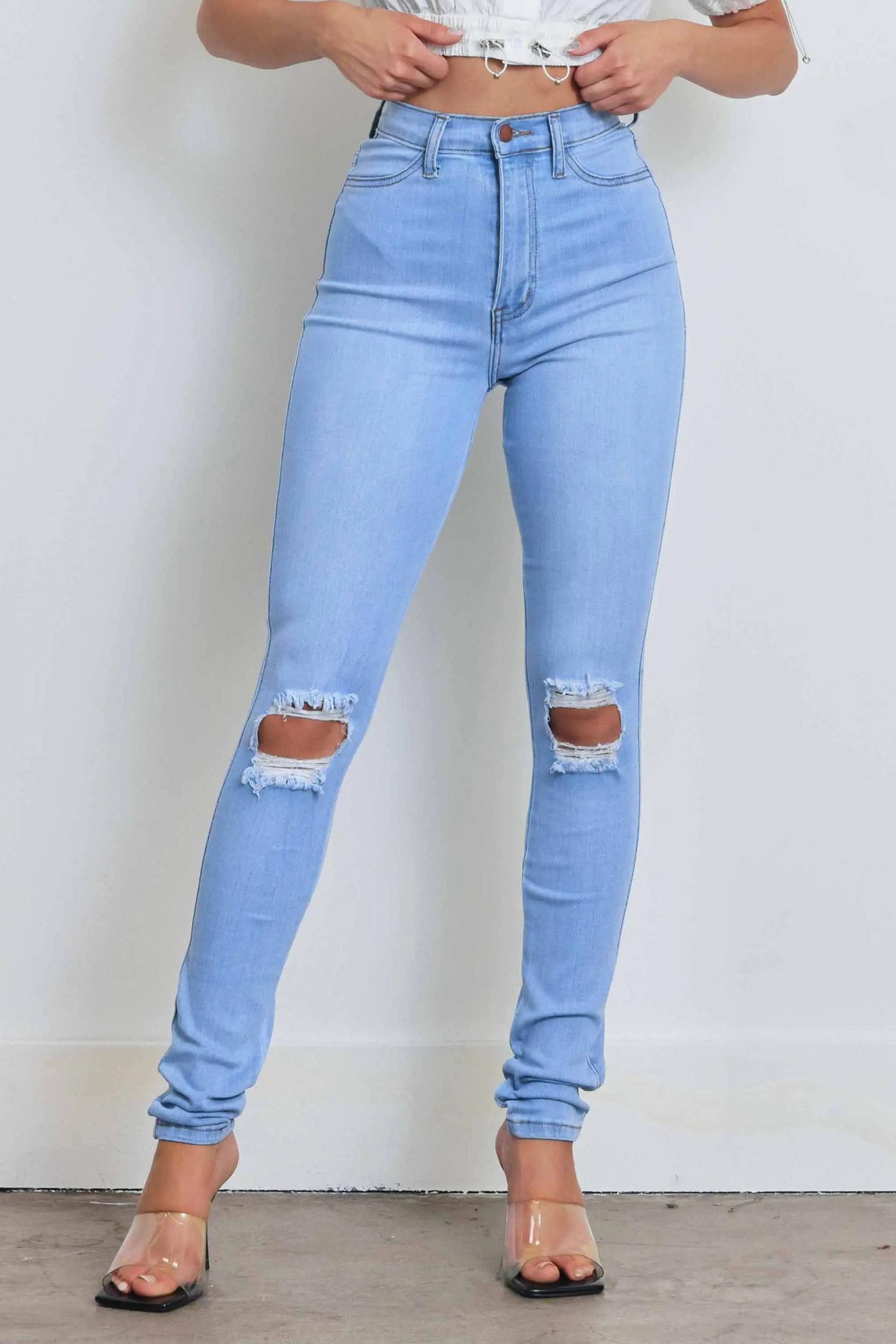 HIGH WAISTED SKINNY W DISTRESS DETAIL