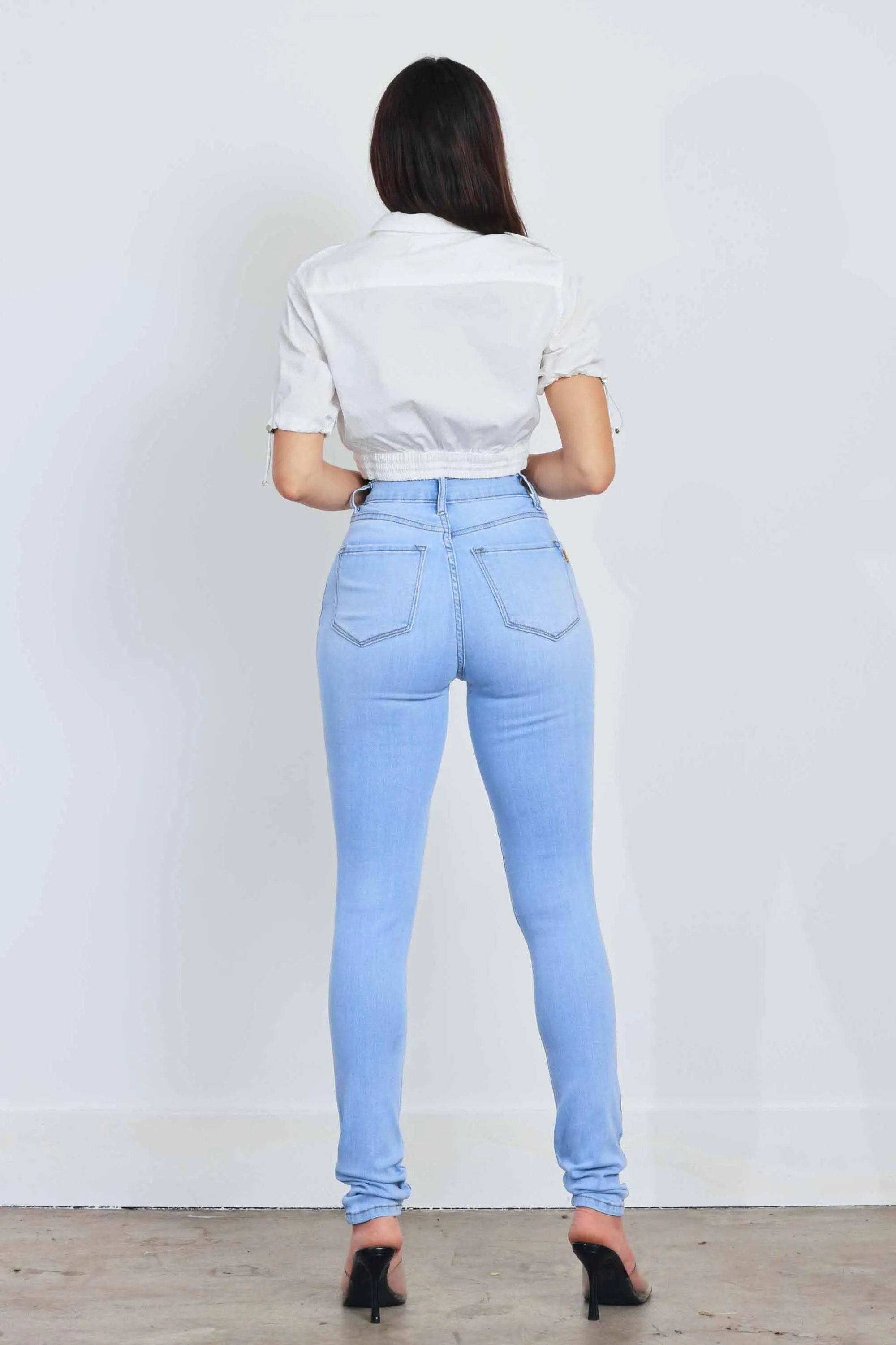 HIGH WAISTED SKINNY W DISTRESS DETAIL